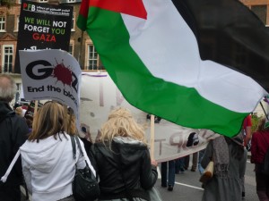 A protester waves the Palestinian flag